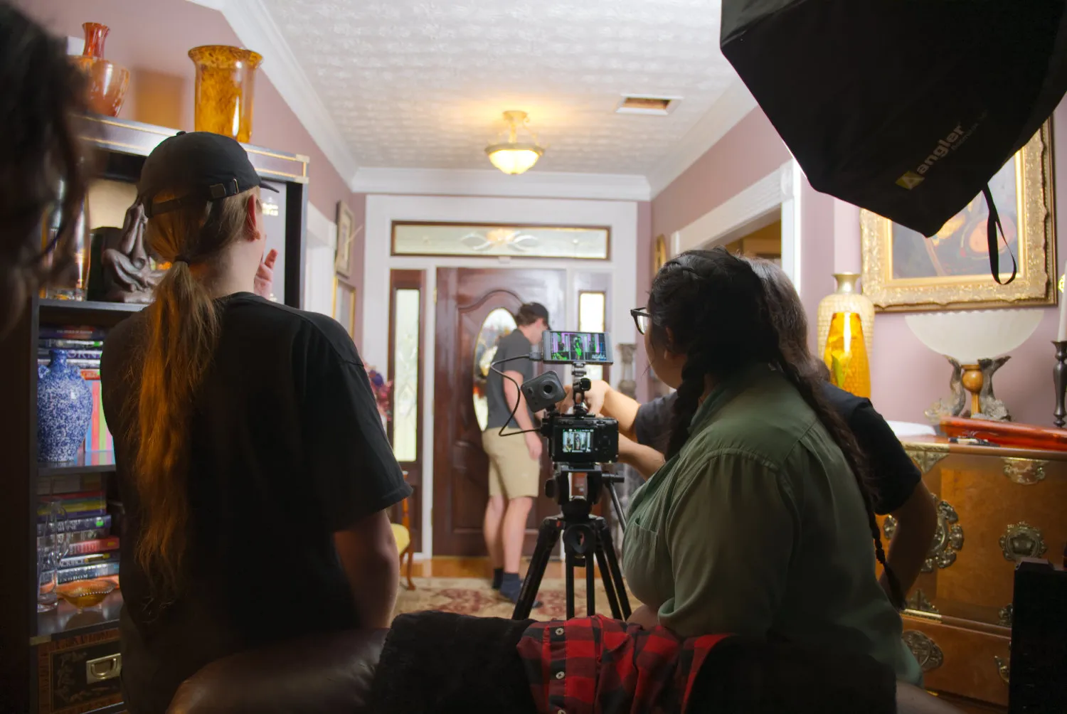 Some of the crew members reviewing a shot. L-R: Rain Bell, William Moriarty, Liliana Guilfoyle
