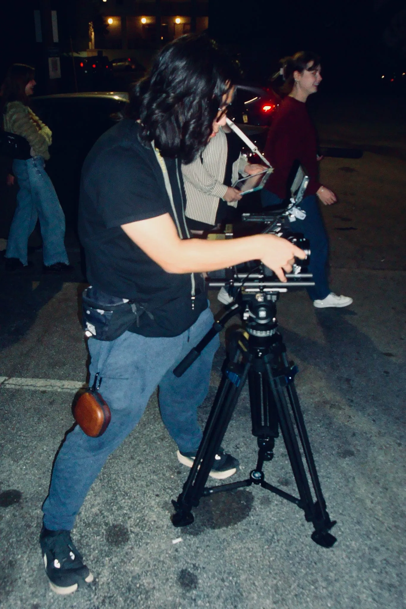 Me working on the camera sitting on top of a tripod.